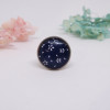 Bague ajustable bleu à fleurs blanches