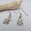 Boucles d'oreilles argentées tête de mort